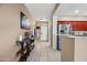 Hallway leading to the kitchen with tile floors and a decorative table at 5318 W Grenadine Rd, Laveen, AZ 85339