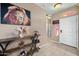 Inviting front entryway with decorative table and light tile flooring at 5318 W Grenadine Rd, Laveen, AZ 85339