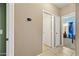 Hallway with views of two bedrooms and the thermostat controller at 5318 W Grenadine Rd, Laveen, AZ 85339
