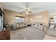 Bright living room with multiple couches, large windows, and stylish decor at 5318 W Grenadine Rd, Laveen, AZ 85339