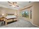 Serene main bedroom with a large bay window, plush carpeting, and ample natural light creating a relaxing retreat at 5318 W Grenadine Rd, Laveen, AZ 85339