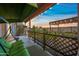 Covered patio with green swing, string lights, and decorative fence for outdoor living and enjoyment at 5318 W Grenadine Rd, Laveen, AZ 85339