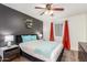 The bright bedroom offers dual bedside tables, a dark accent wall, and window at 533 W Guadalupe Rd # 1001, Mesa, AZ 85210