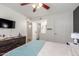 This lovely bedroom gives way to ensuite bath and features a mounted TV at 533 W Guadalupe Rd # 1001, Mesa, AZ 85210