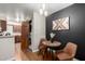 Dining area with laundry access, hardwood floors, modern lighting, and sleek design at 533 W Guadalupe Rd # 1001, Mesa, AZ 85210