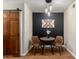 Cozy dining area featuring a modern light fixture and trendy accent wall at 533 W Guadalupe Rd # 1001, Mesa, AZ 85210