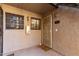 Front entry with security door and neutral paint, plus a 'wipe your paws' welcome mat at 533 W Guadalupe Rd # 1001, Mesa, AZ 85210