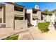 Charming two-story condo with a stucco exterior, stairway access, and desert landscaping at 533 W Guadalupe Rd # 1001, Mesa, AZ 85210