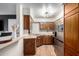 Modern kitchen with stainless steel appliances, wood countertops, and a sliding wood door at 533 W Guadalupe Rd # 1001, Mesa, AZ 85210