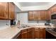 Features of the kitchen include stainless steel appliances and wood cabinets at 533 W Guadalupe Rd # 1001, Mesa, AZ 85210