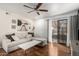 Bright living room with wood floors, neutral palette, ceiling fan, and balcony access at 533 W Guadalupe Rd # 1001, Mesa, AZ 85210