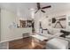 Comfortable living room featuring hardwood floors, neutral tones, and ample seating at 533 W Guadalupe Rd # 1001, Mesa, AZ 85210