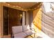 Relaxing patio featuring cozy sofa and view of door and windows framed by twinkling string lights at 533 W Guadalupe Rd # 1001, Mesa, AZ 85210