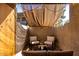 Outdoor patio featuring cozy seating, sunshade and string lights, offering a relaxing outdoor space at 533 W Guadalupe Rd # 1001, Mesa, AZ 85210