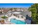 Aerial view of the backyard featuring a pool and multiple lounge and patio areas at 5333 E Catalina Ave, Mesa, AZ 85206