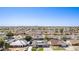 High-angle aerial view of a neighborhood with varied roof styles and desert landscaping under a clear blue sky at 5333 E Catalina Ave, Mesa, AZ 85206