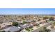 Overhead neighborhood view showcasing well-maintained homes, mature trees, and blue sky on a bright, sunny day at 5333 E Catalina Ave, Mesa, AZ 85206