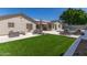 This backyard features a pool, lounging area, and outdoor seating, perfect for enjoying sunny days at 5333 E Catalina Ave, Mesa, AZ 85206