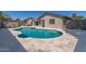 The backyard boasts a sparkling pool with blue tile accents, offering a refreshing escape at 5333 E Catalina Ave, Mesa, AZ 85206