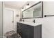 Bathroom vanity with a large mirror, double sinks, and grey cabinets at 5333 E Catalina Ave, Mesa, AZ 85206