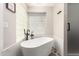 Luxurious bathroom featuring a freestanding tub and a glass block window for natural light at 5333 E Catalina Ave, Mesa, AZ 85206