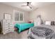Shared bedroom with two twin beds, white dressers, and a serene atmosphere at 5333 E Catalina Ave, Mesa, AZ 85206