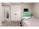 Comfortable bedroom features a door to bathroom, mint dresser, and plush carpet at 5333 E Catalina Ave, Mesa, AZ 85206
