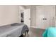 Bedroom featuring carpeted floors, white closet doors, and a cozy aesthetic at 5333 E Catalina Ave, Mesa, AZ 85206
