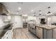 The kitchen island, stainless appliances, and open layout make this kitchen inviting at 5333 E Catalina Ave, Mesa, AZ 85206