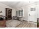 Inviting living room featuring wood floors, a plush rug, and stylish furnishings at 5333 E Catalina Ave, Mesa, AZ 85206