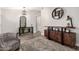 Bright living room featuring wood floors, a plush rug, and stylish furnishings at 5333 E Catalina Ave, Mesa, AZ 85206