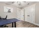 Functional office space with a blue desk, laminate flooring, and ample natural light at 5333 E Catalina Ave, Mesa, AZ 85206