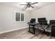 Bright office featuring laminate floors, multiple desks, and lots of natural light at 5333 E Catalina Ave, Mesa, AZ 85206