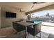 This cozy outdoor dining area offers a view of the pool at 5333 E Catalina Ave, Mesa, AZ 85206