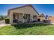Expansive backyard, featuring a partially covered patio, a dining area, and well-maintained landscaping at 6279 S Martingale Ct, Gilbert, AZ 85298