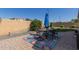 Paver patio with outdoor seating and a colorful rug provides a relaxing space at 6279 S Martingale Ct, Gilbert, AZ 85298