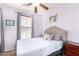 Serene bedroom with a padded headboard, soft lighting, and neutral decor accents at 6279 S Martingale Ct, Gilbert, AZ 85298