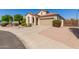 Well-maintained home with a spacious driveway and low-maintenance desert landscaping at 6279 S Martingale Ct, Gilbert, AZ 85298