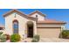 Inviting single-Gathering home with a charming stone-accented entrance and a two-car garage at 6279 S Martingale Ct, Gilbert, AZ 85298