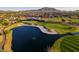 Golf course with views of homes and the mountains at 6279 S Martingale Ct, Gilbert, AZ 85298
