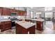 Modern kitchen with granite countertops, stainless steel appliances, and a center island for entertaining at 6279 S Martingale Ct, Gilbert, AZ 85298