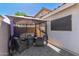 Backyard with a paved area featuring an outdoor lounge with shade at 640 E Browning Way, Chandler, AZ 85286