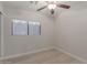 Bright bedroom showcasing wood flooring, a window, and a ceiling fan at 640 E Browning Way, Chandler, AZ 85286