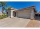 Welcoming single-story home with tile roof, desert landscaping, and an attached two-car garage at 640 E Browning Way, Chandler, AZ 85286