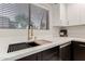 Contemporary kitchen sink with white quartz countertops and designer faucet fixture at 640 E Browning Way, Chandler, AZ 85286