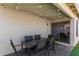 A covered patio with string lights illuminates an outdoor dining space at 640 E Browning Way, Chandler, AZ 85286