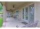 Relaxing back porch with ceiling fans and views of the landscaped backyard at 6793 W Angela Dr, Glendale, AZ 85308