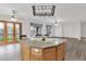 Spacious kitchen with an island with seating, French doors to the backyard, and lots of light at 6793 W Angela Dr, Glendale, AZ 85308
