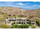 Expansive luxury home boasts multiple balconies, lush landscaping, and an inviting outdoor space perfect for entertaining at 7046 N 59Th Pl, Paradise Valley, AZ 85253