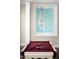 Pool table underneath the decorative window and chandelier in the recreation room at 7046 N 59Th Pl, Paradise Valley, AZ 85253